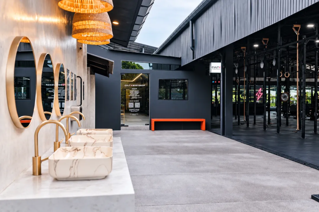 Outdoor washbasins and courtyard beside the CULT gym.