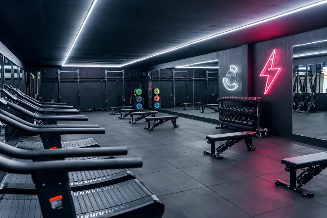 Curved treadmills and strength equipment in the CULT gym.