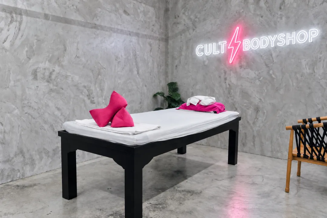 Massage table prepared with towels at CULT BodyShop.